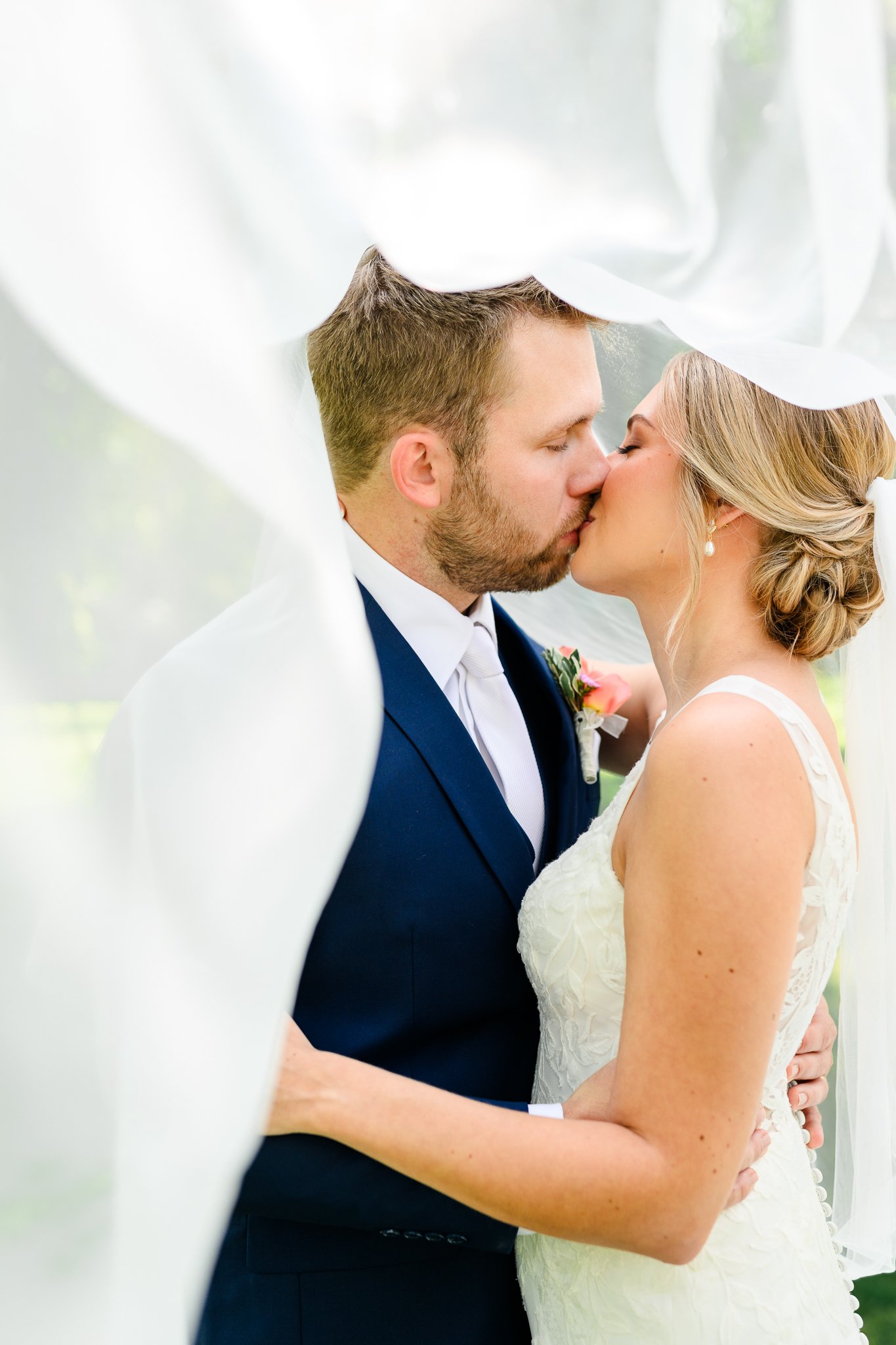 Rich & Rachel on their wedding day at Holy Cross Catholic Church, Fargo, ND, photographed by Chelsea Joy Photography